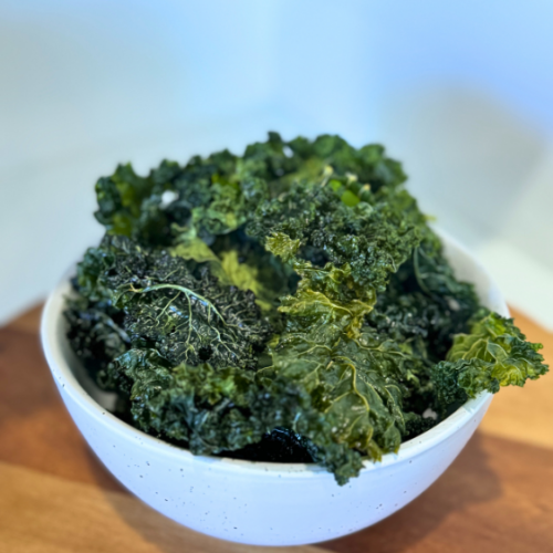 White bowl of kale chips