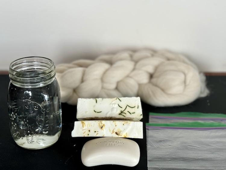 Roving, water, soap, ziplock bags for making alpaca felted soap