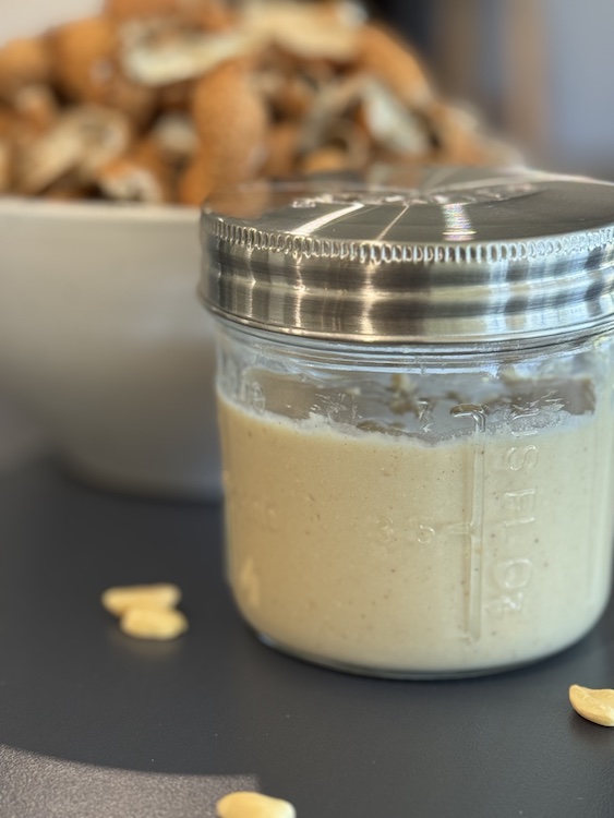 Kilner jar of Peanut Butter with peanut shells in background