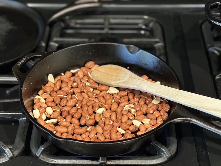 Removing skins from peanuts on the stove